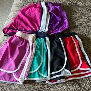 Six pair of running shorts. Nike and Reebok.